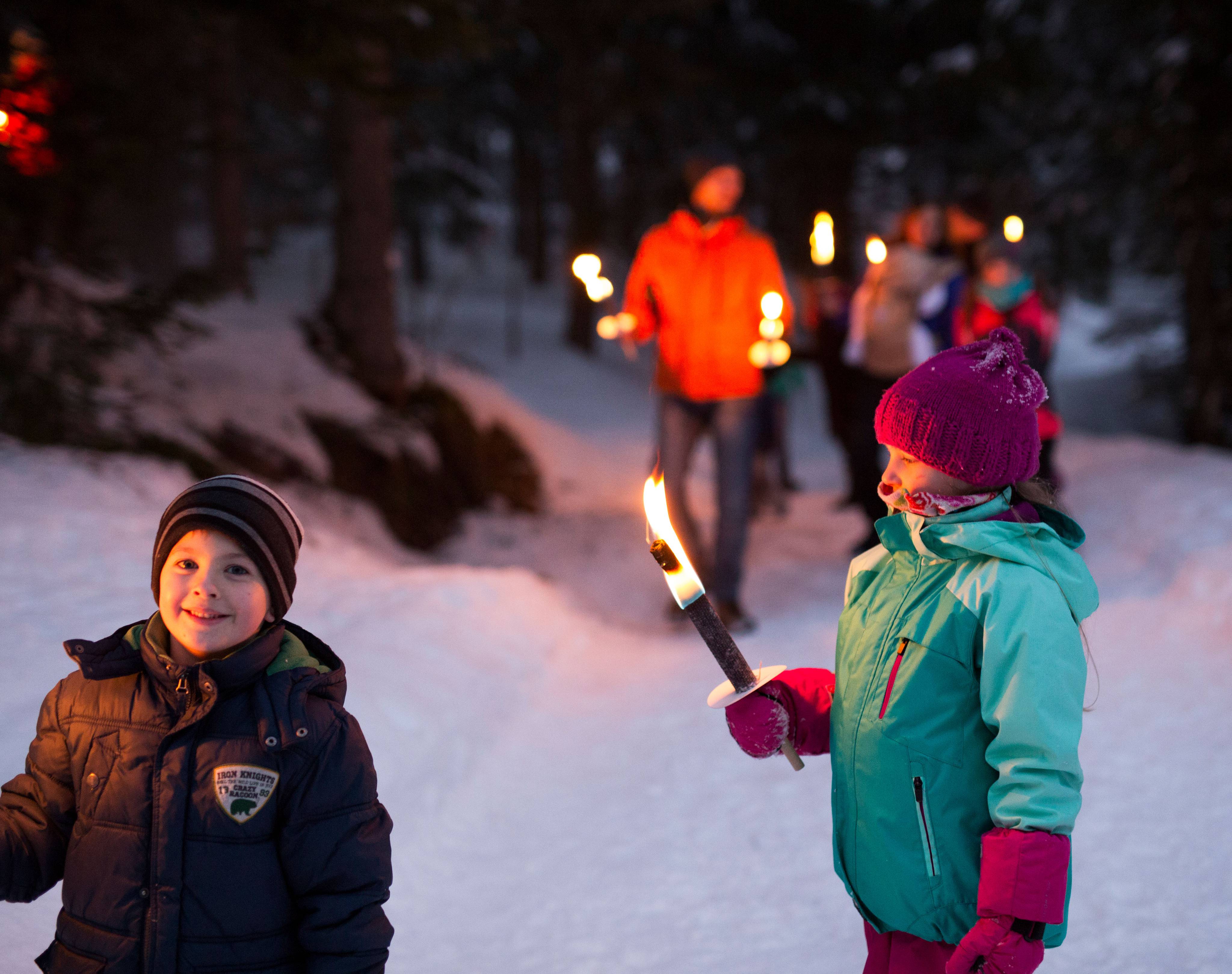 Torchlight hike through the snow in Berwang, Tyrol