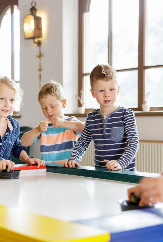 Children playing Air Hockey