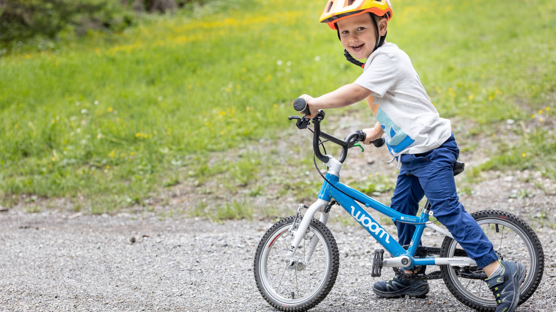 Boy standing on a balance bike