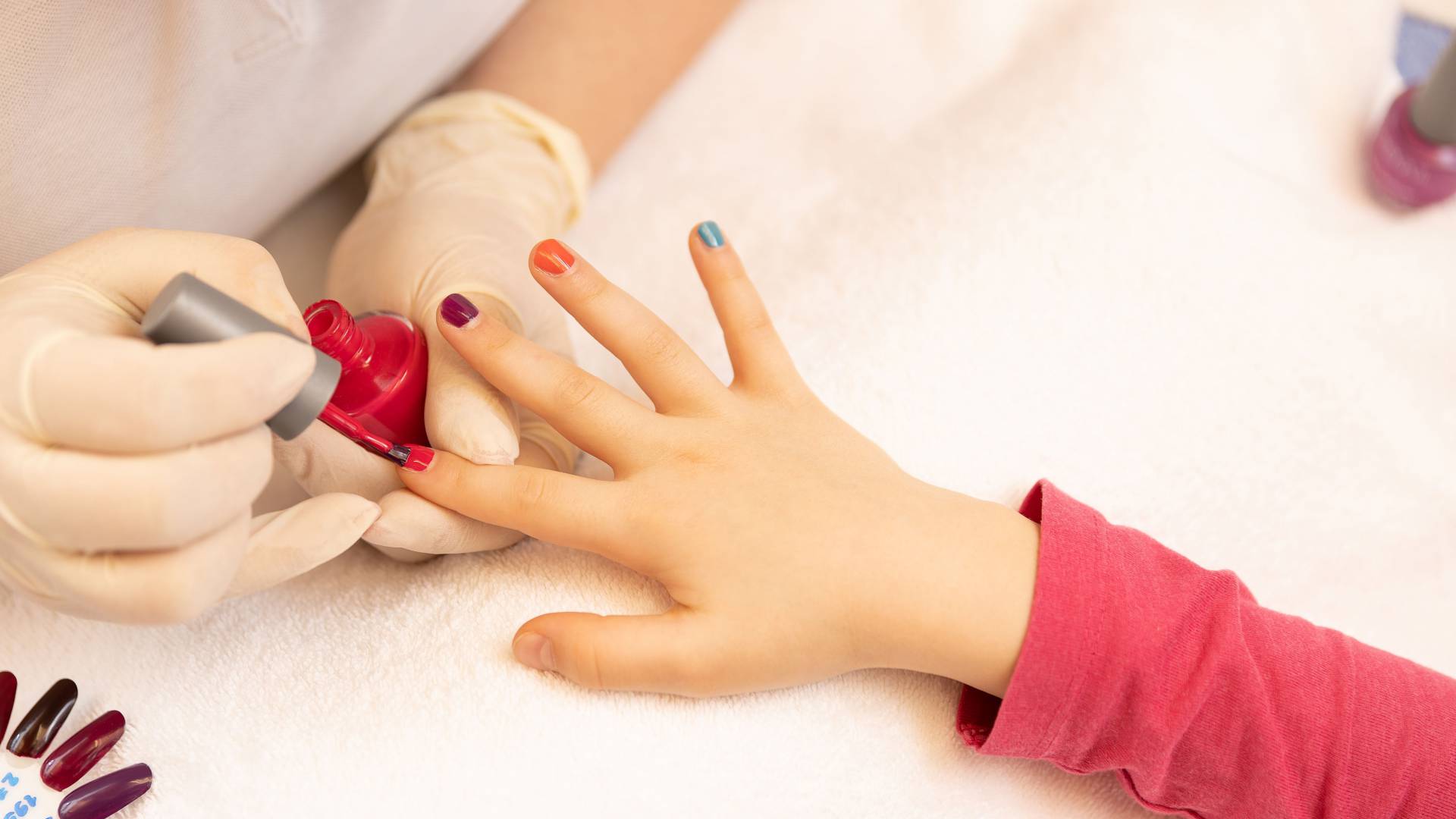 Child gets fingernails painted