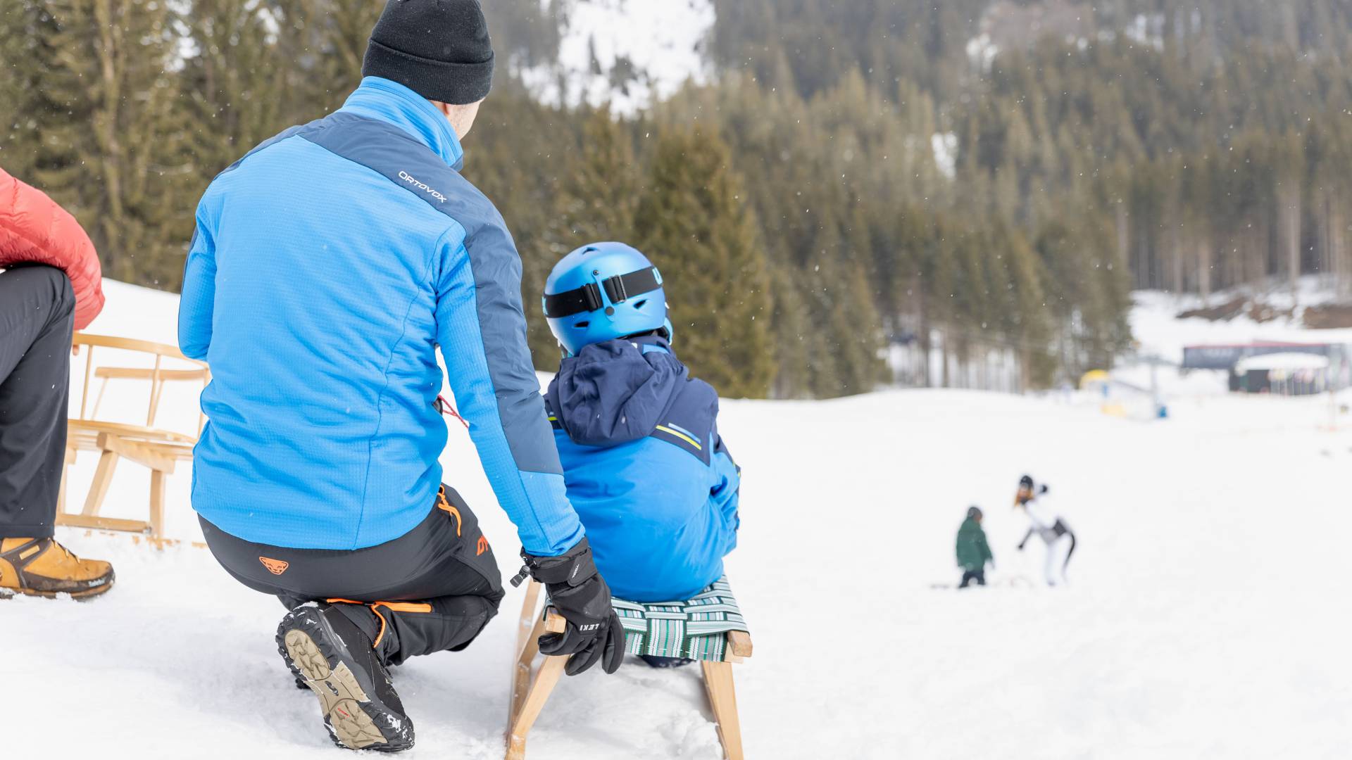 Father and son tobogganing in the Zugspitz Arena